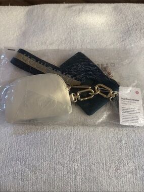 NWT, Lululemon forest green / bone dual pouch wristlet .